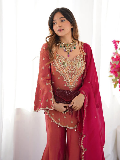 Royal elegance in this beautifully embroidered pink Sharara set.