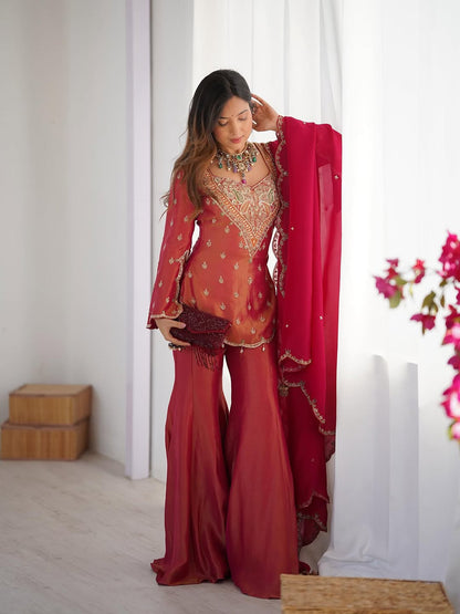 Royal elegance in this beautifully embroidered pink Sharara set.