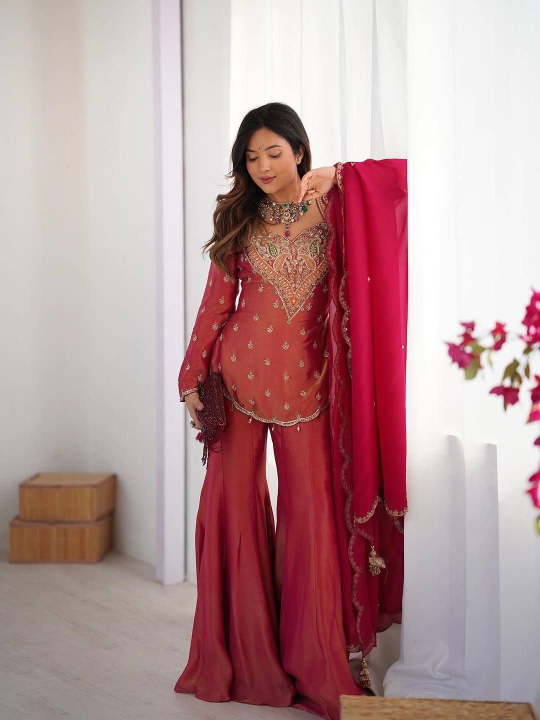 royal elegance in this beautifully embroidered pink sharara set.