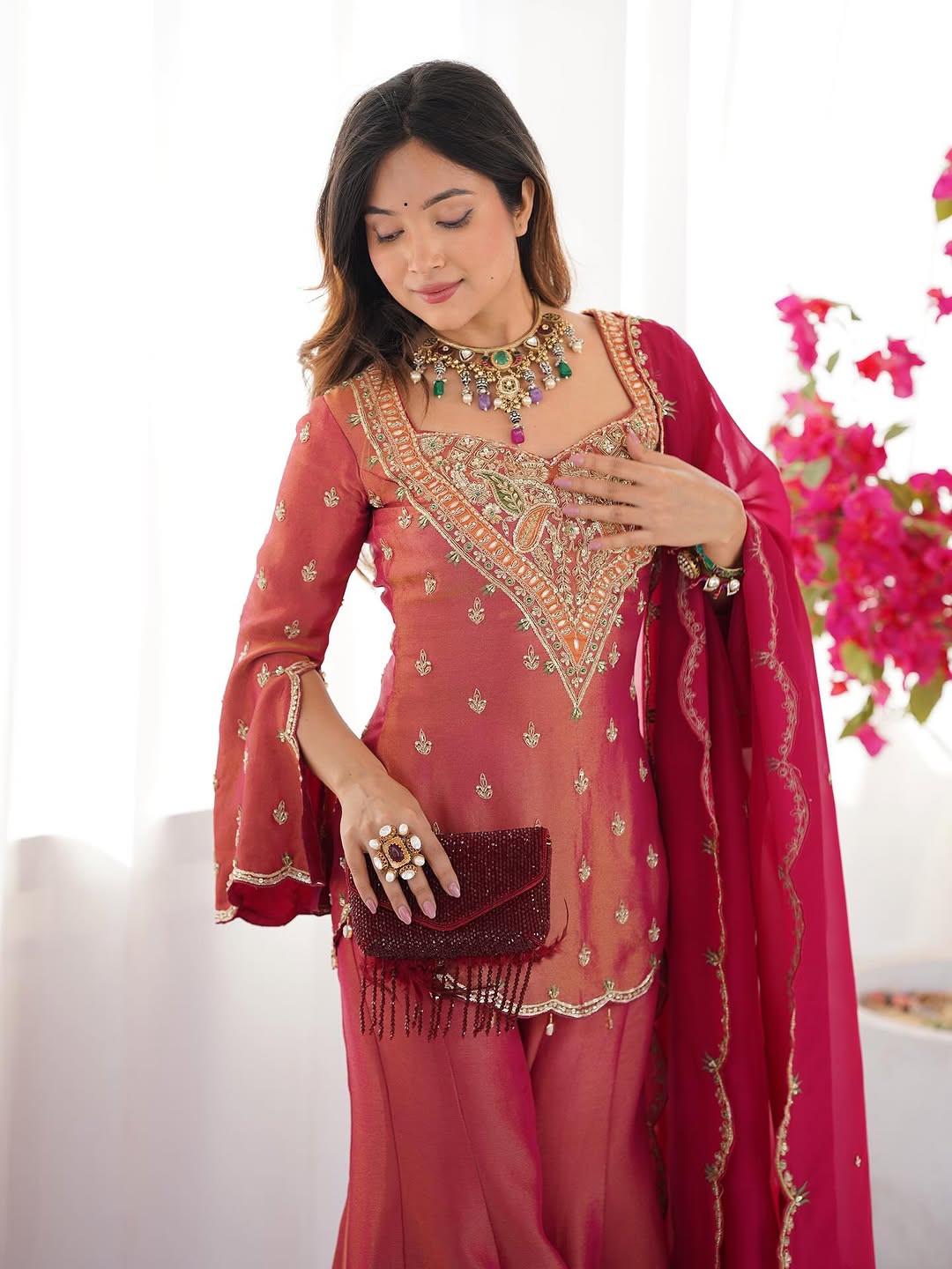 royal elegance in this beautifully embroidered pink sharara set.