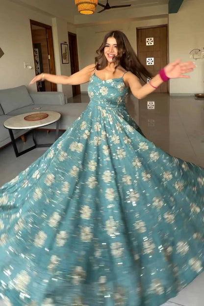 Teal embroidered fancy silk Anarkali suit.