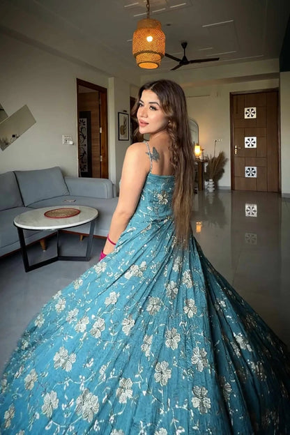 Teal embroidered fancy silk Anarkali suit.