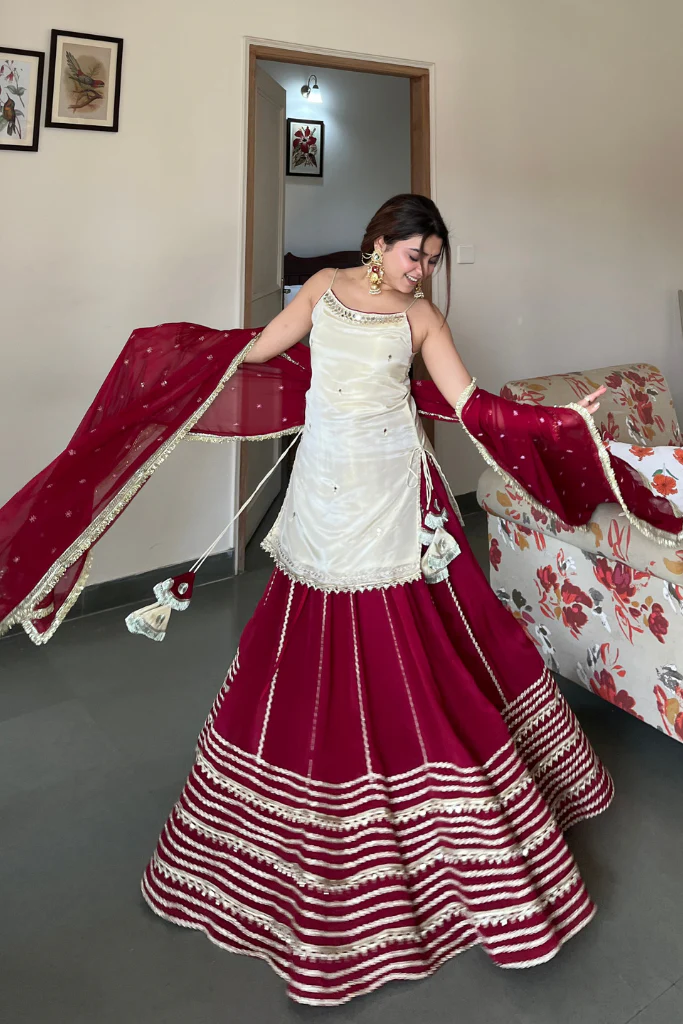 elegant ruby red sharara suit set with ivory embroidered kurti