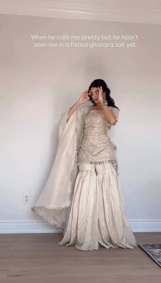Handcrafted Ivory Georgette Gharara Suit with Mirror Work & Tassel Detailing