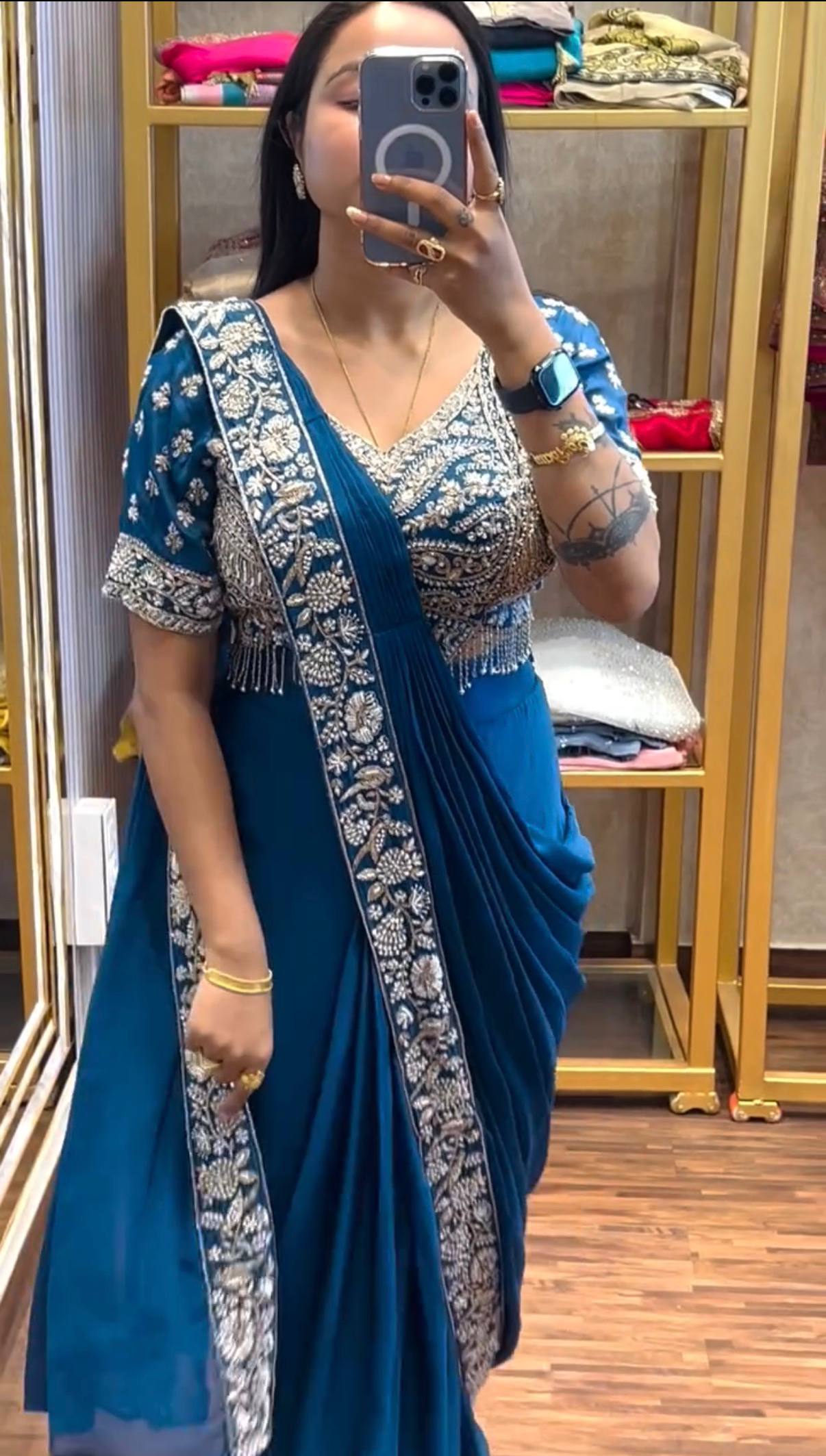 peacock blue silk drape saree with heavy silver zardosi work blouse