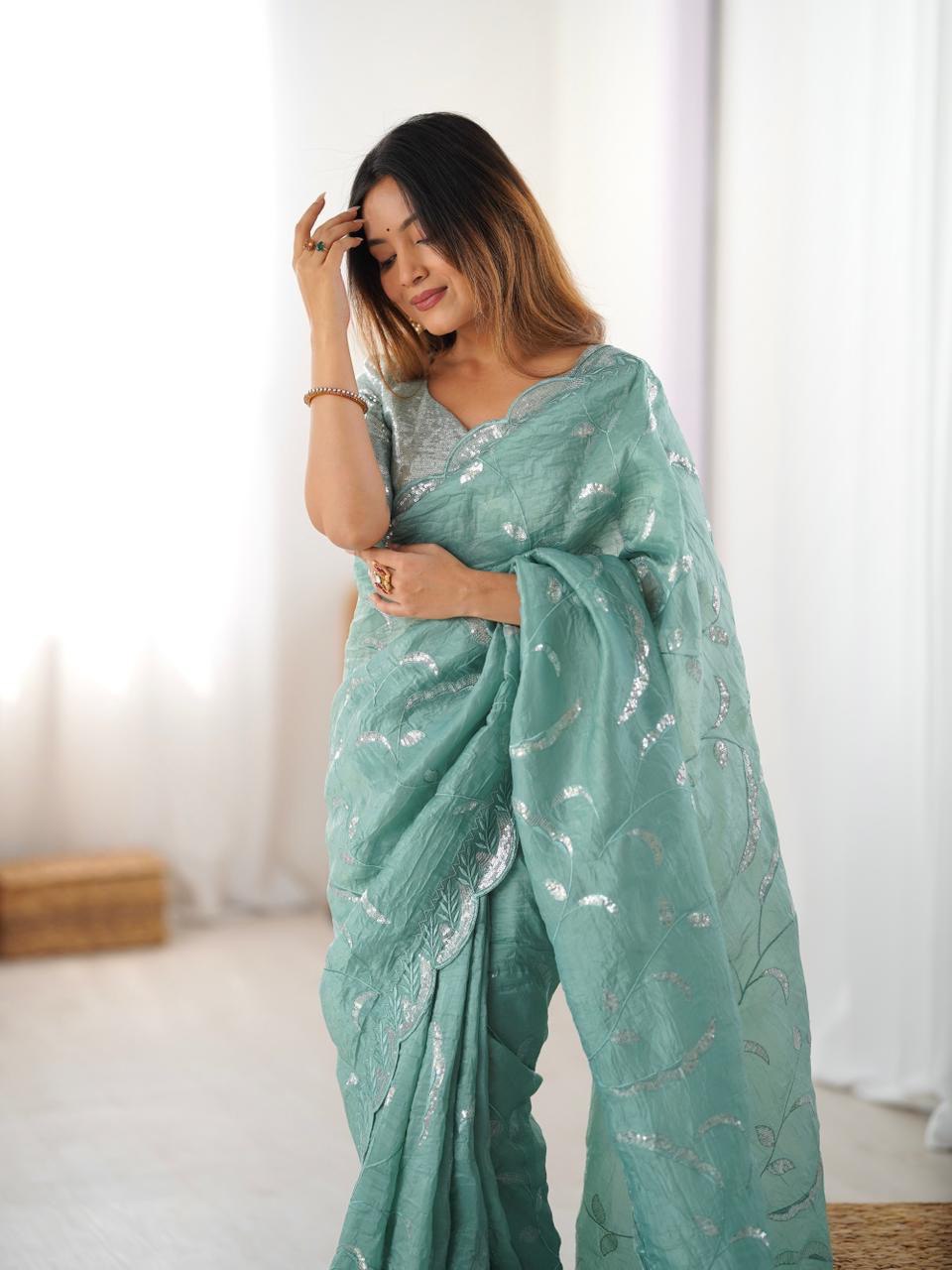 sage green embroidered saree with matching blouse